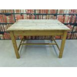 A rustic pine kitchen table (L124 x W95 x H80cm)