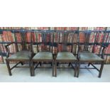 Four lyre back style dining chairs with upholstered seats,