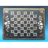 A mother of pearl inlaid papier maché chess board (W45cm x D33cm)