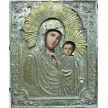 A Russian icon of the Virgin Mary with Jesus in a decorative silver plated frame,
