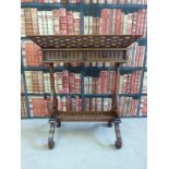 A pierced mahogany plant stand with scrolling design to legs