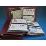 Two albums of GB presentation packs and two albums of first day covers