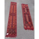 A pair of red ground wool runners with fringed ends (175cm x 33cm,