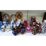 A large quantity of ceramics and glass including Cranberry glass jug, Goss crested ware,