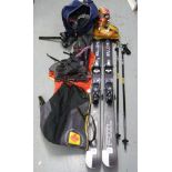 A pair of Salomon skis and boots, both in bags together with Lexi poles,