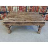 A rustic hardwood coffee table