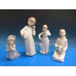 Four Nao figures including an angel playing a banjo,