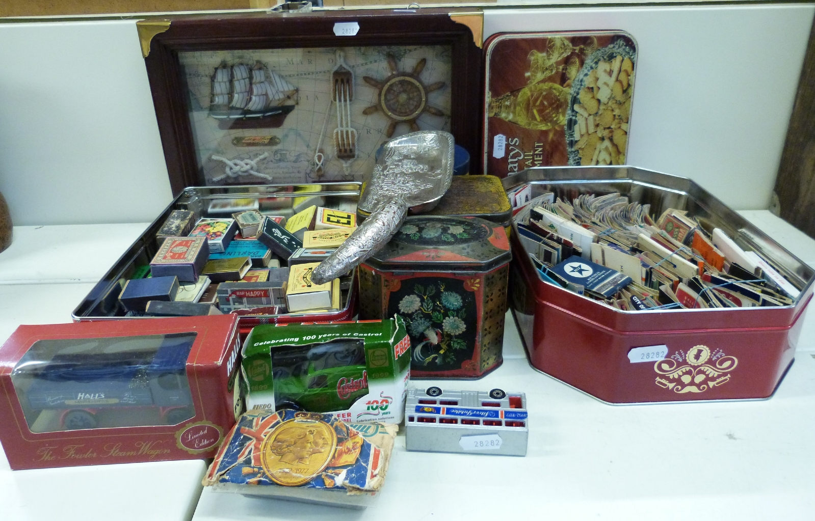A quantity of collectables including matchboxes, tins, toy cars,
