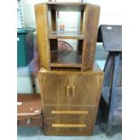 An Art Deco cupboard with two drawers below, together with an octagonal occasional table,