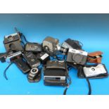 A collection of vintage cameras and equipment including a Keystone cine camera, Halina, Panasonic,