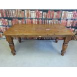 A Cotswold Collection pine kitchen table with substantial turned legs (L183 x W98 x H80cm)