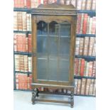 An oak glazed bookcase/ display cabinet (W57 x D29 x H131cm)