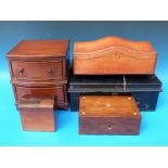 An apprentice bow fronted chest of two drawers together with a gilt leather shaped stationery box