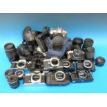 A quantity of various SLR cameras including Pentax, Canon AE 1, Canon EOS, Olympus,