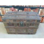 A vintage ash and metal bound domed steamer trunk,