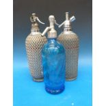 Three soda siphons including a blue glass 'Stanfields,