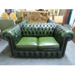 A green leather two-seat Chesterfield sofa (length 153cm)