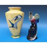 A Wilkinson pottery vase with bird finial,