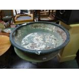 A large green painted feeding or washing bowl (diameter 92cm)