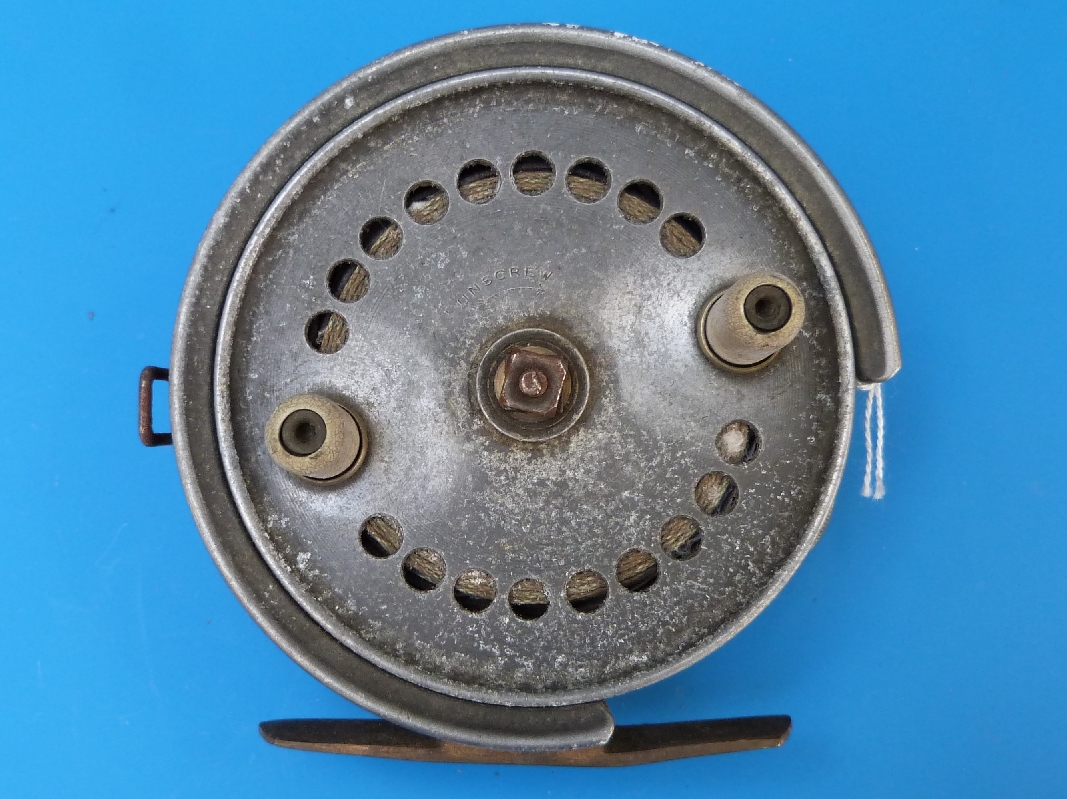 An S Allcock & Co Redditch Easicast 4" fishing reel with brass foot and twin handles.