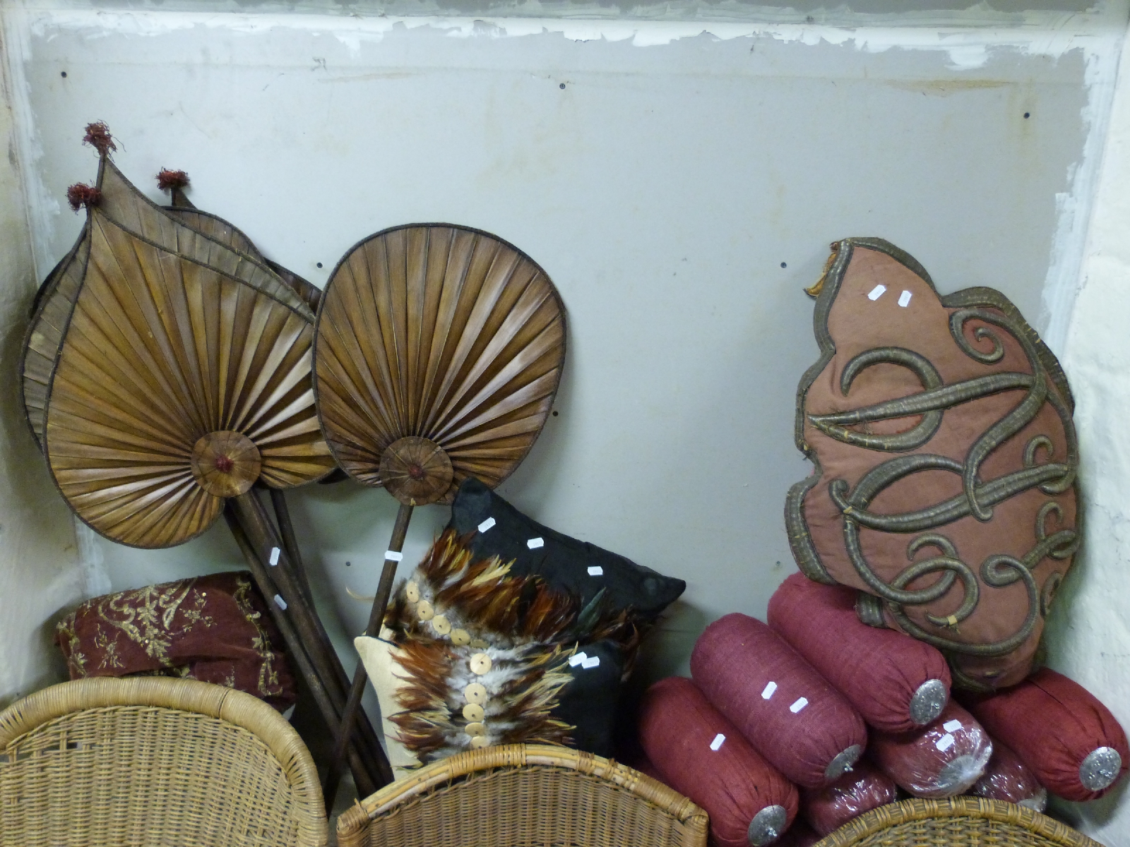 A quantity of fans, various cushions, two wooden carriers and various globes etc.