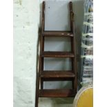 A mahogany folding library step ladder