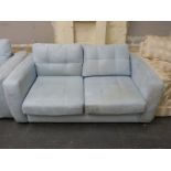 A blue suede two-seater sofa bed (length 174cm)