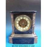 A slate mantel clock with ivory dial coloured chapter ring, brass two train movement, serial no.