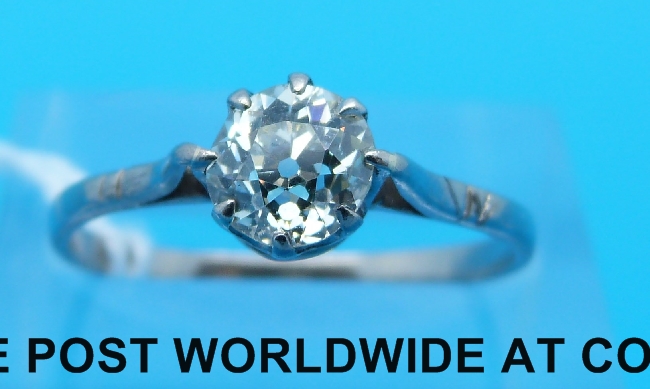 A platinum ring set with round brilliant cut diamond of approximately 0.