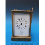 A brass carriage clock by E & E Emmanuel, Portsea,