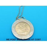 A 9ct gold clip mounted 1968 gold full sovereign on a yellow metal chain (10.