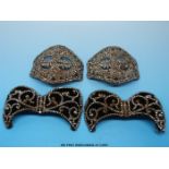 A pair of 19thC velour and cut steel buckles in the shape of bows with scrolling decoration and a