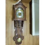 A large chiming wall clock with German weight driven movement