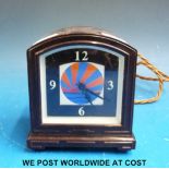 An Art Deco bakelite electric alarm clock,