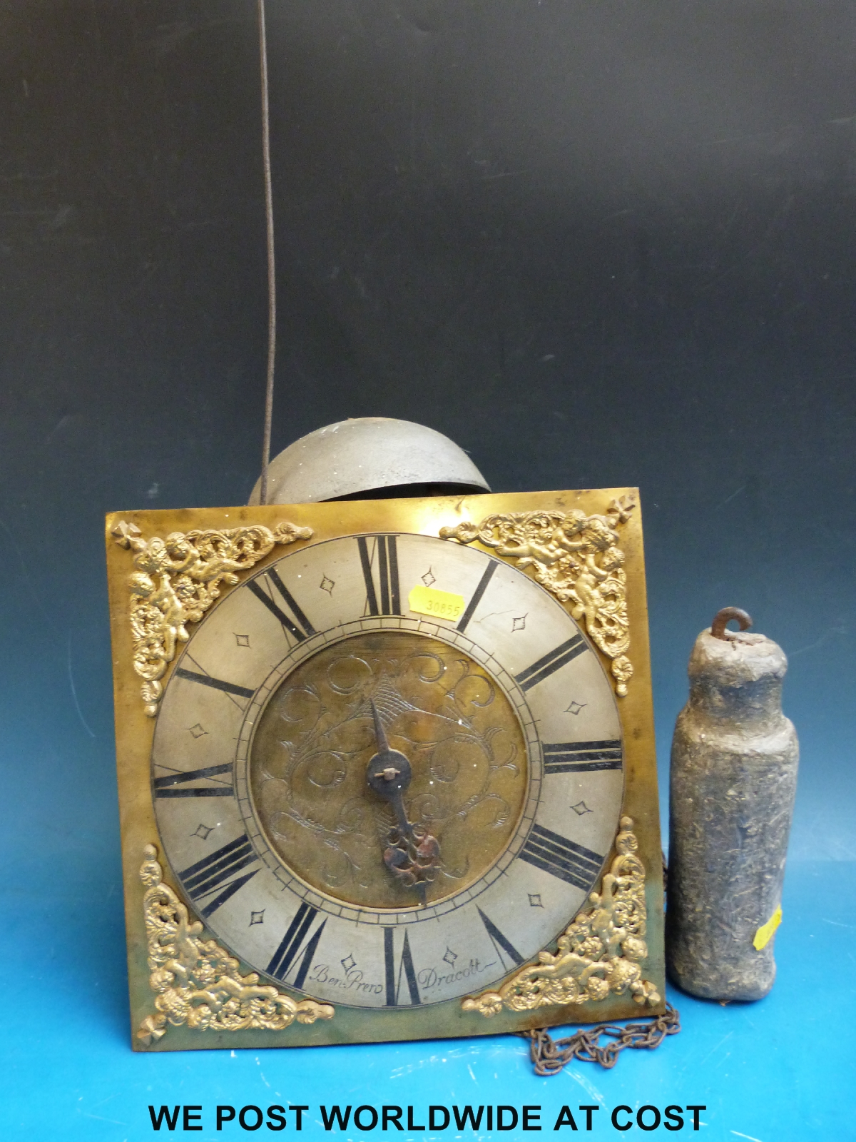 A c1720 long cased clock movement and dial, complete with original weight and pendulum.