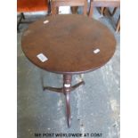 A Victorian walnut veneered circular pedestal table with carved and turned supports