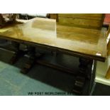 An oak draw leaf refectory table by G T Rackshaw of Worcester