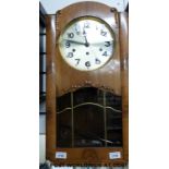 A c1910 wall clock in lightwood case and Westminster chime