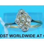 A yellow metal ring marked 18ct set with old cut diamonds in a marquise shape cluster (size R)