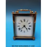 A brass French carriage clock in leather case