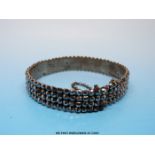 A Victorian cut steel bangle made up of four rows of circular faceted stones