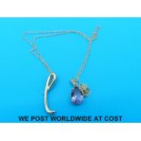 A yellow metal amethyst pendant necklace stamped 14K together with another pendant marked 9K