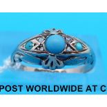 A hallmarked 9ct gold ring set with turquoise and diamonds,