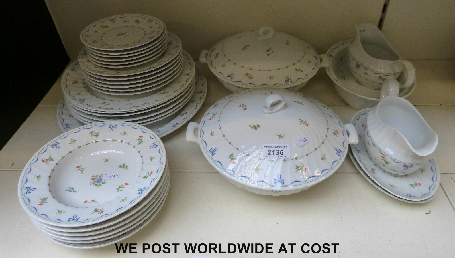 A six setting Royal Worcester dinner service in Ribbons and Bows pattern including meat dish,