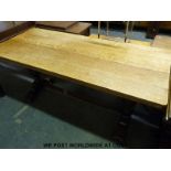 A light oak refectory table with bulbous supports (h76cm x l105cm x w76cm)