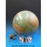 A vintage light up globe on a chrome base (height 38cm)