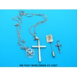 A crucifix and chain marked 375 and a 9ct gold pin with eagle decoration etc (10.