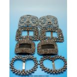 Four pairs of cut steel shoe buckles three pairs with border decoration made up of faceted round