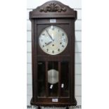 An c1910 oak cased three train wall clock with dual chime Whittington and Westminster feature