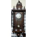 A Vienna regulator style mahogany wall clock with carved horse finial